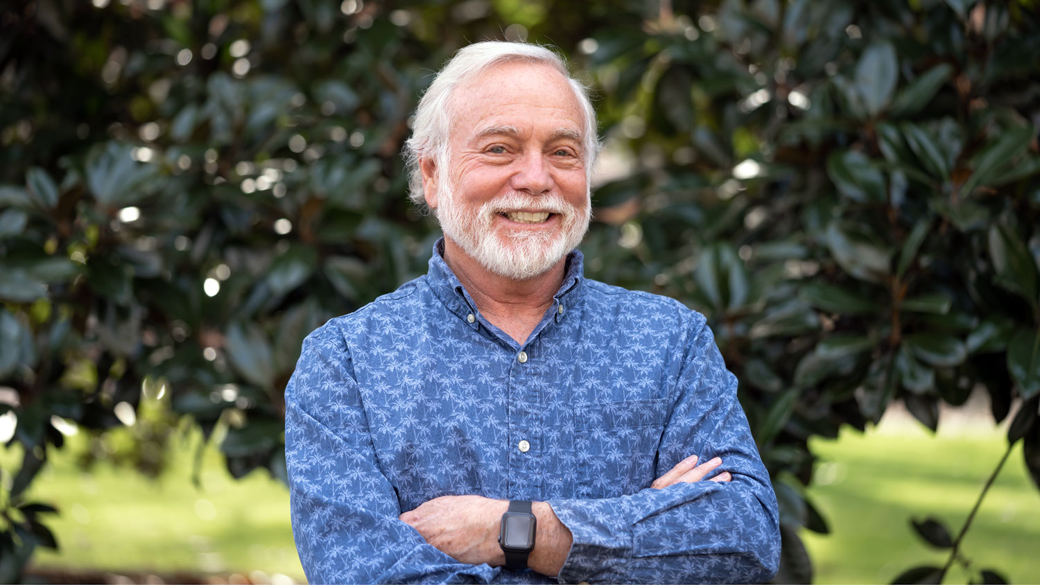 Fred Gould in front of magnolia